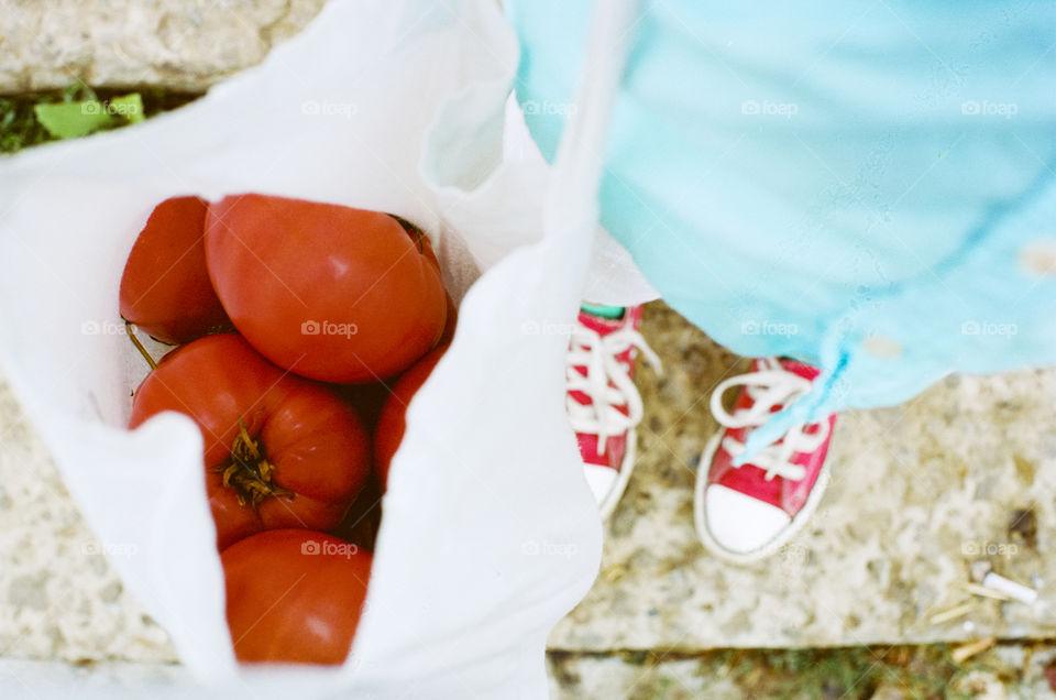 Red Converse and tomatoes