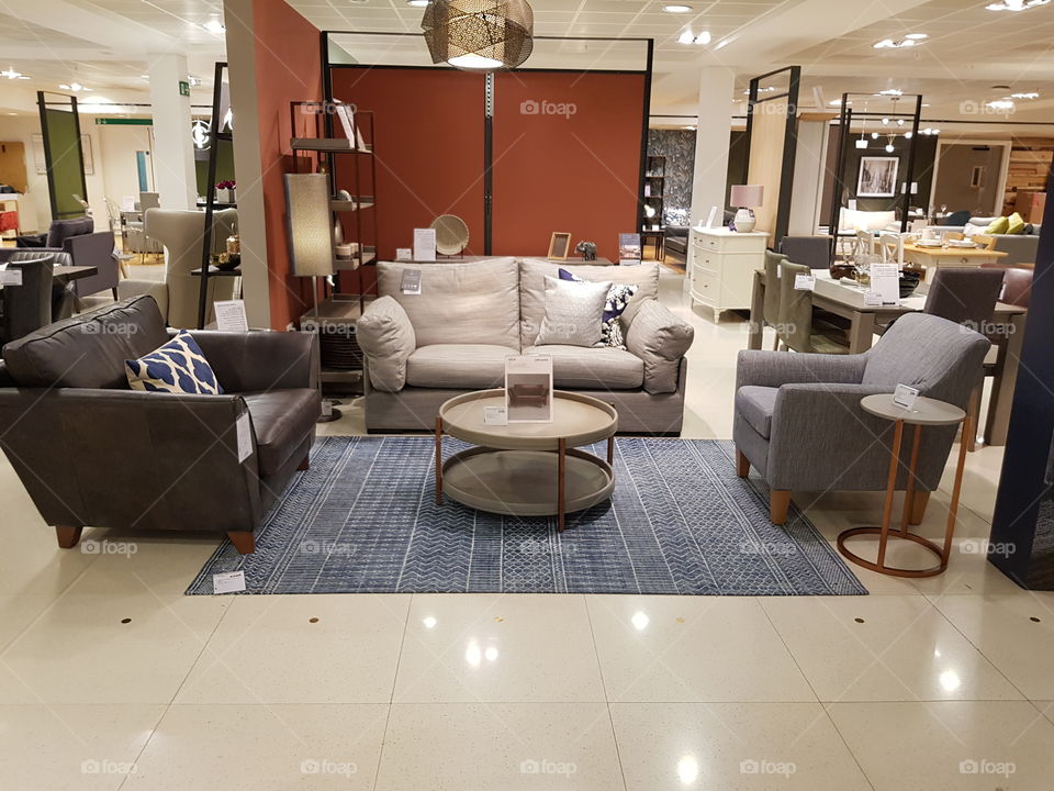 Living space coffee table with rugs and sofas at Peter Jones Sloane square Chelsea King's road London