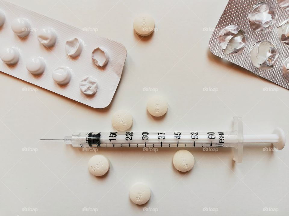 Syringe and Blister of pills