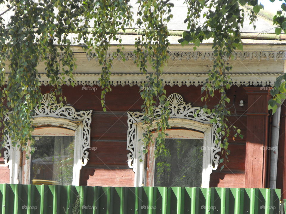 Traditional Russian woodcarvings on a cottage,  Moscow Region