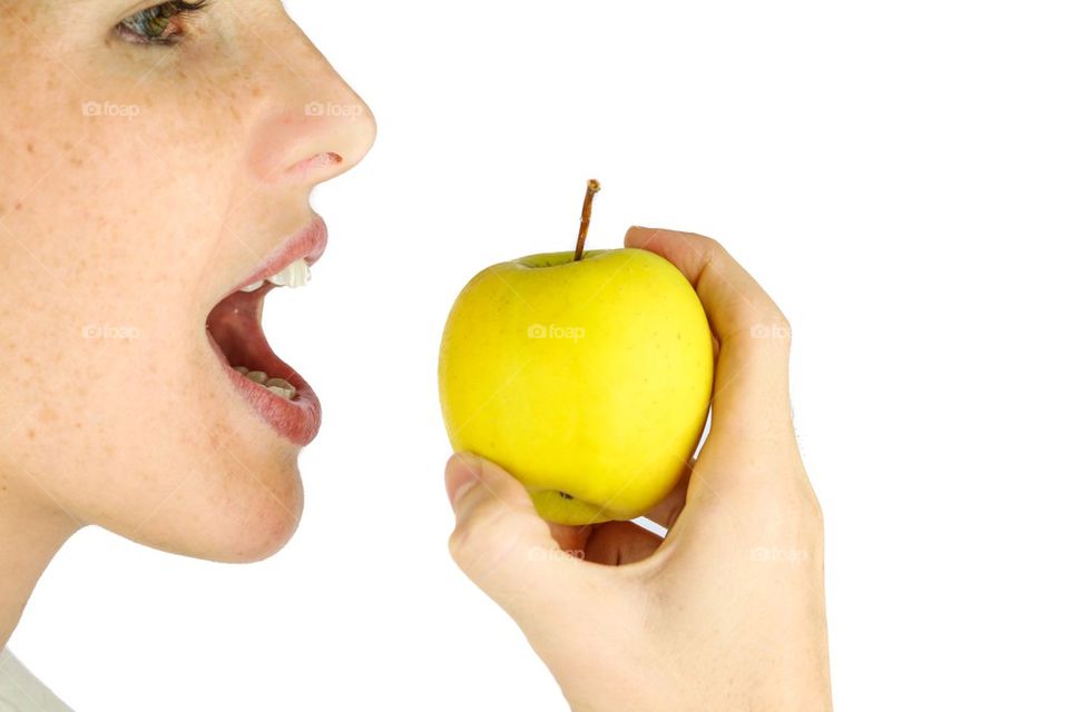 Girl about to eat an apple