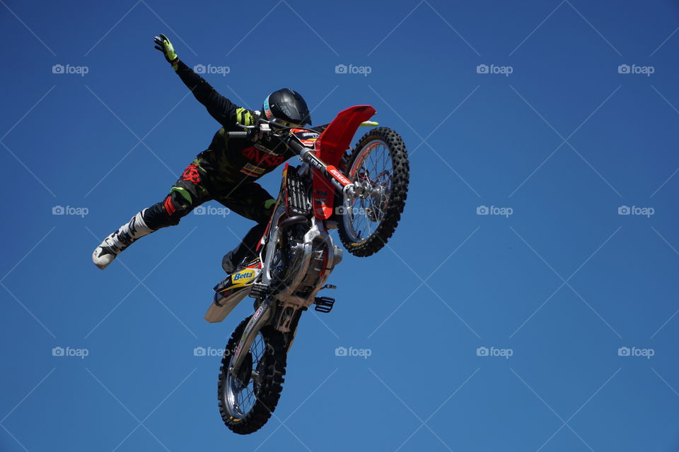 Stunt rider performing on a motorcycle