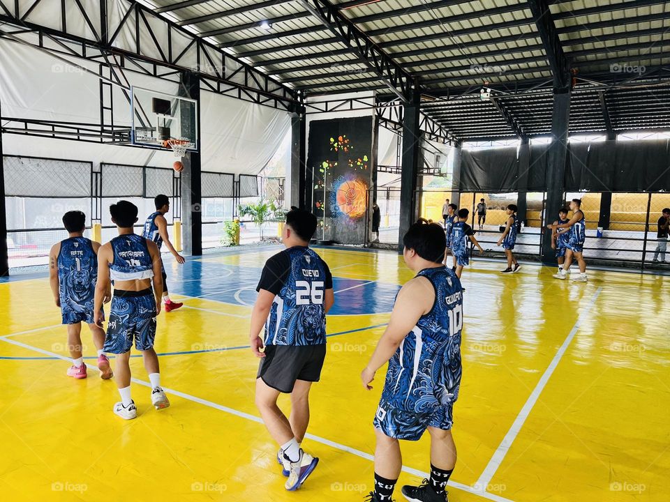 Basketball practice in an indoor court