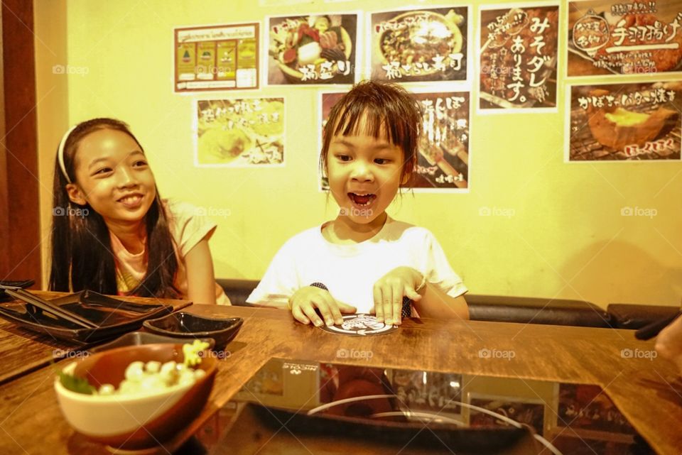 Japanese girl exciting on her dinner