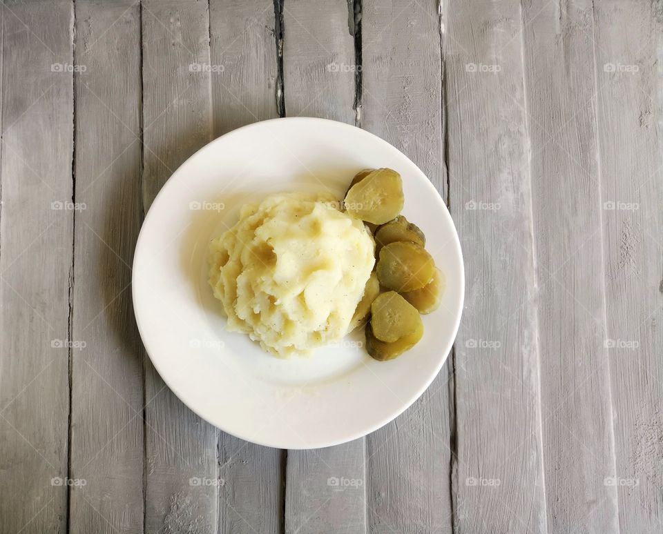 mashed potatoes and pickled cucumber