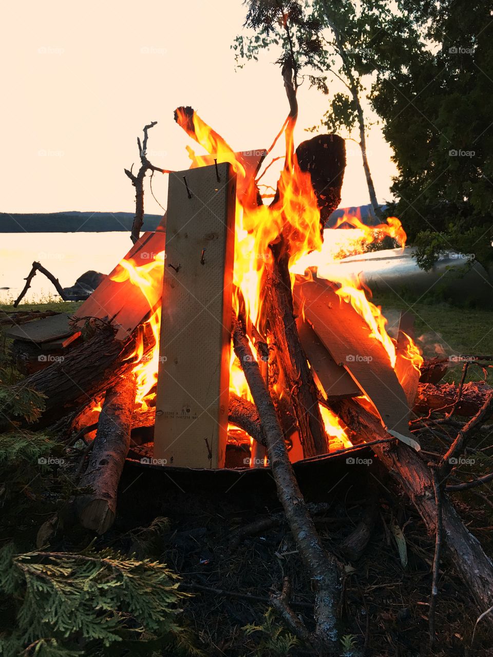 Campfire bonfire at the lake in the Adirondack mountains