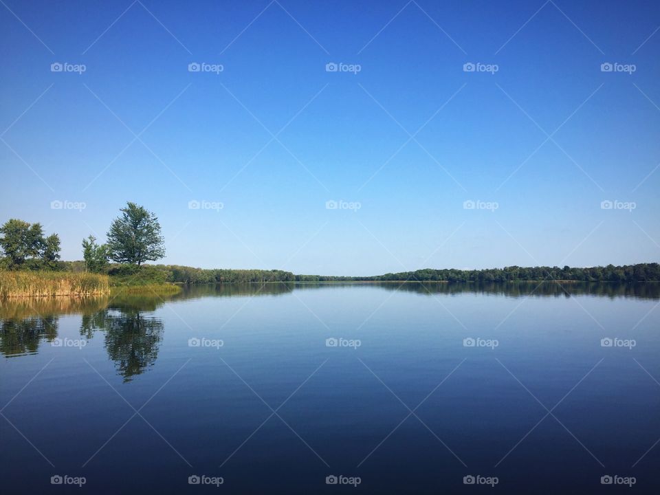 Calm blue lake and clear sky