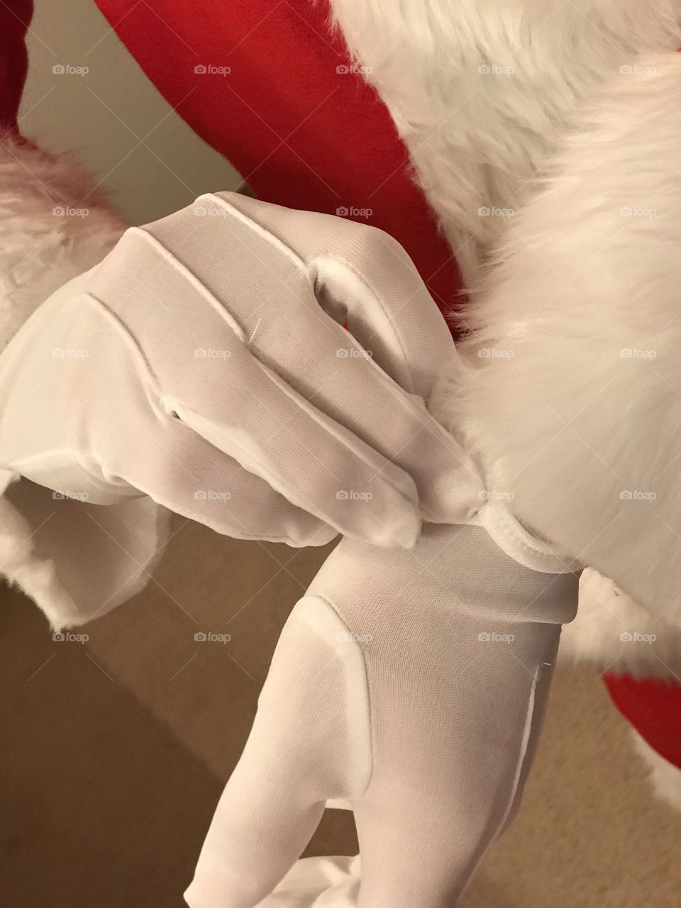 Santa Claus is getting ready for the big night.  Time to put on the white gloves!  Christmas time moments.