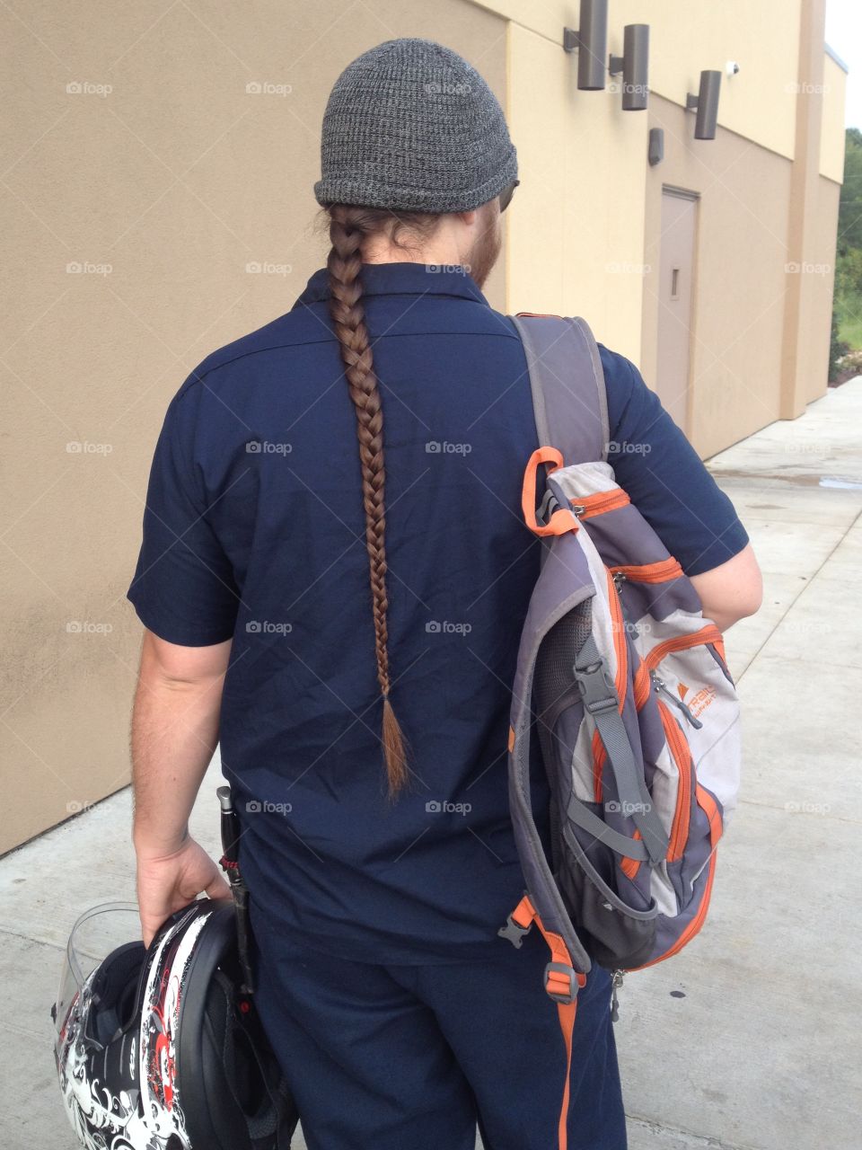 Man with long hair braid.