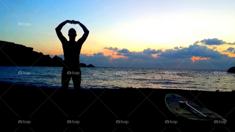 Tai chi on the beach at sunset