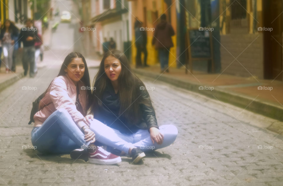 Students sitting on the street