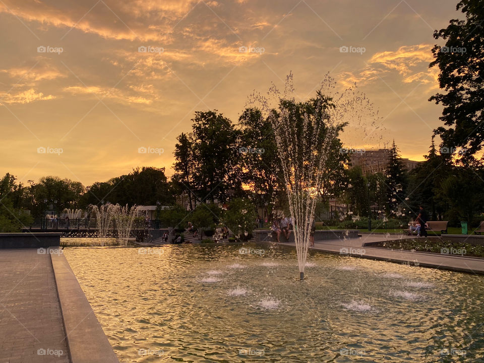 Fountain in the evening at sunset