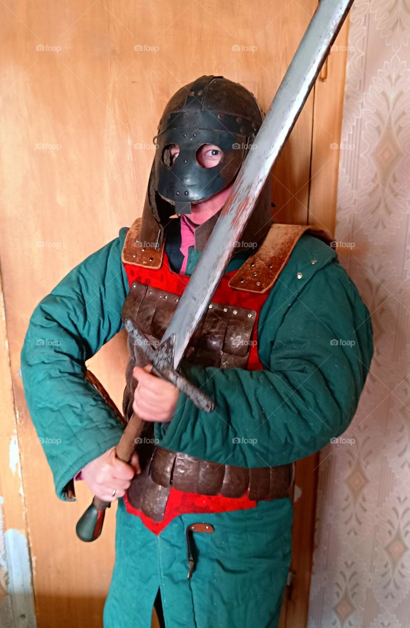 woman in armor and with a sword