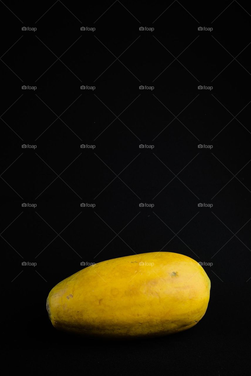 Tropical papaya on black background