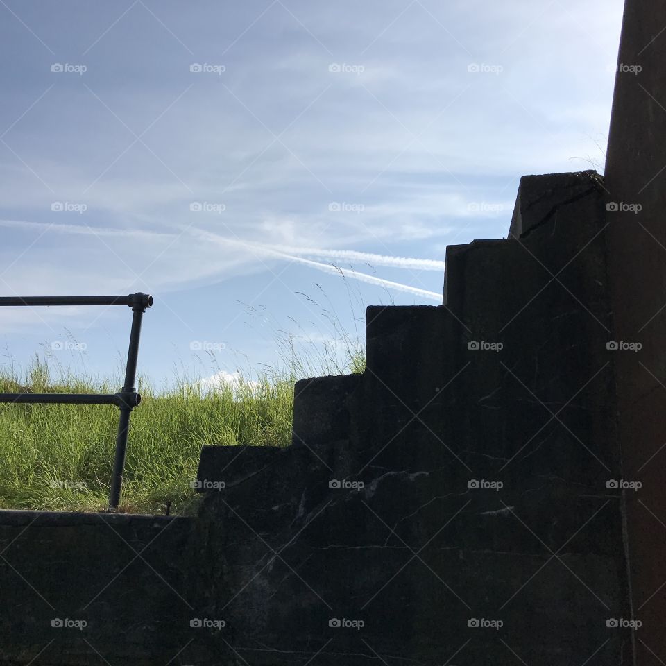 Stairway to Heaven. Staircase set in silhouette against the blue sky.