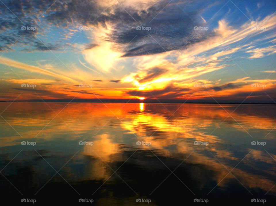 Dramatic sky reflecting on sea