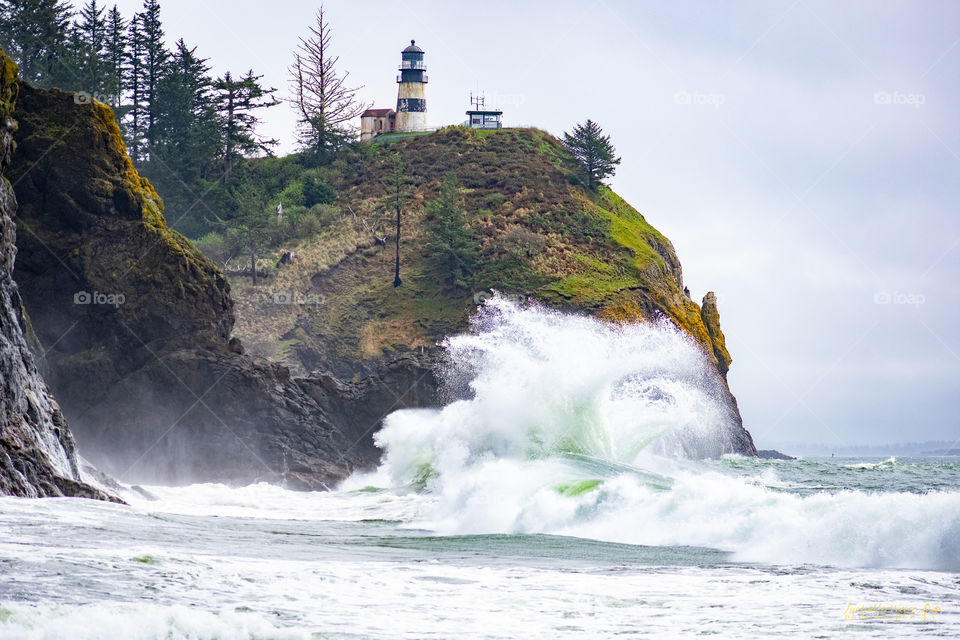 Powerful waves crashing below the Cape Disappointment lighthouse. 