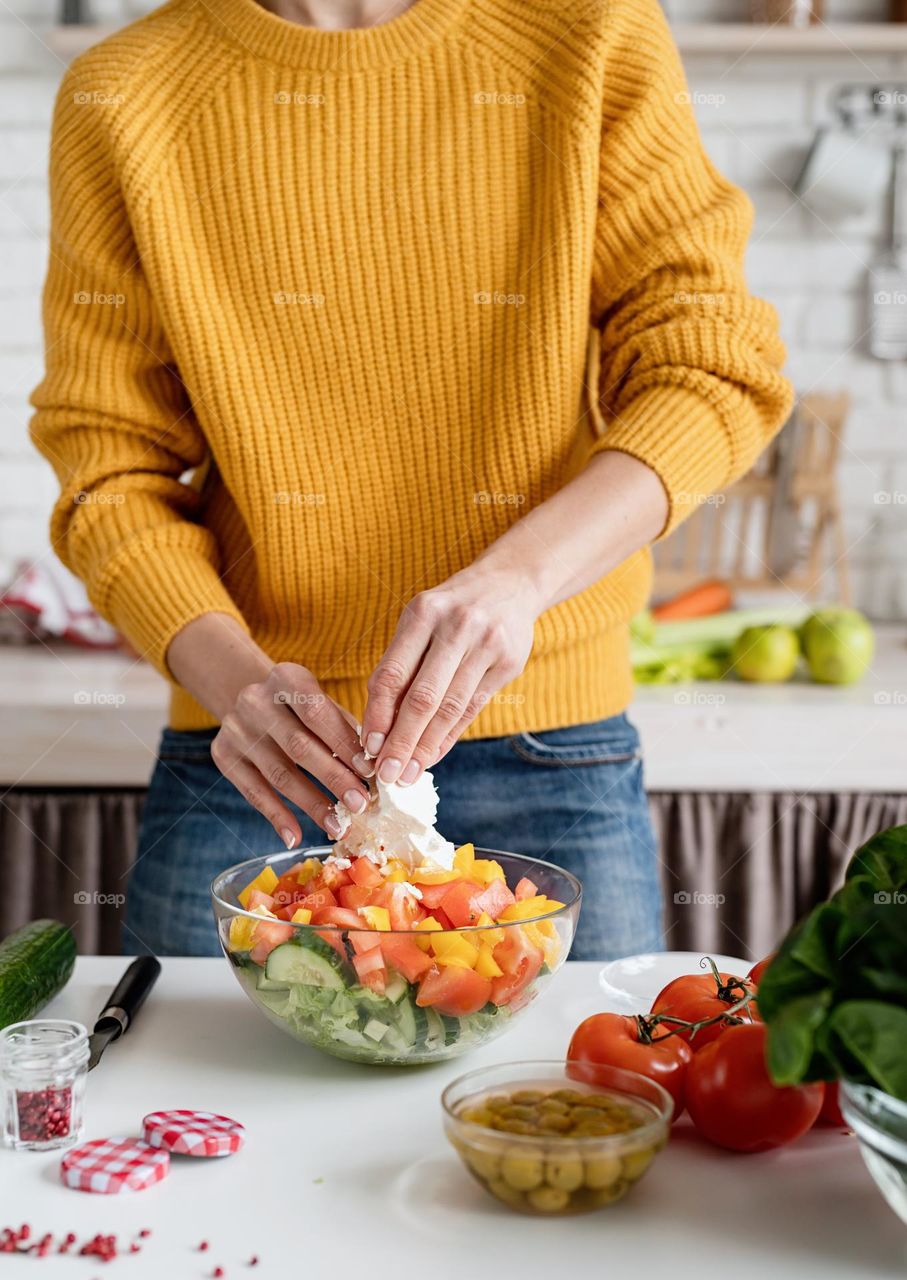 woman making salad