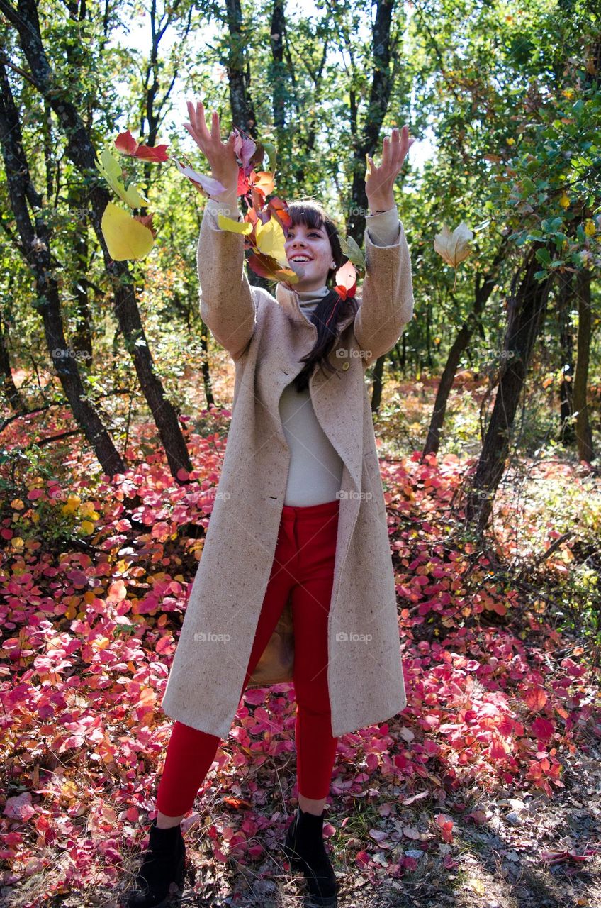 Woman smiling on autumn background