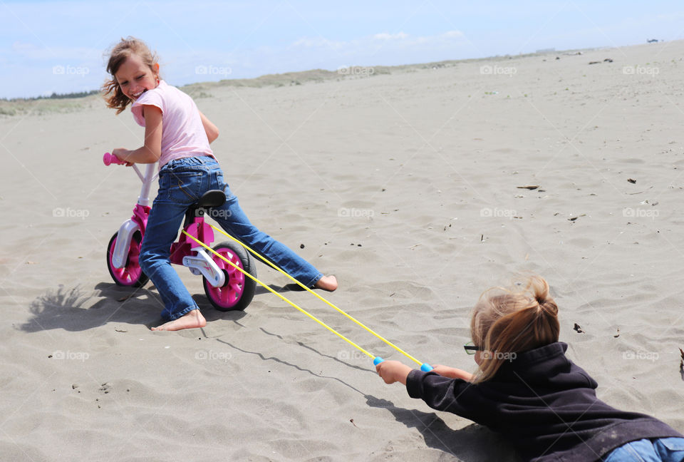 Sisters playing at the beach