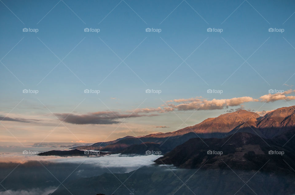 Fog over mountains at sunset 