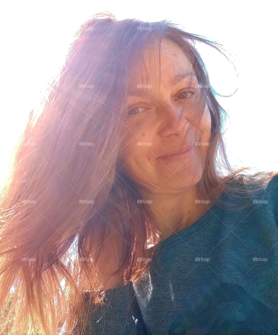 natural brunette woman beautiful portrait in sunlight, selfie woman