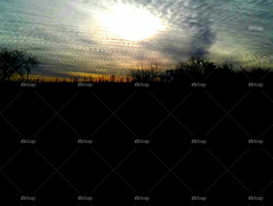 Sunset with clouds and a beautiful landscape