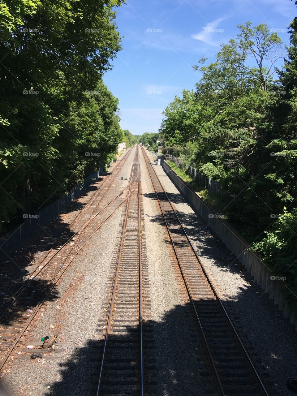 Three railroad tracks leading to an endless point!