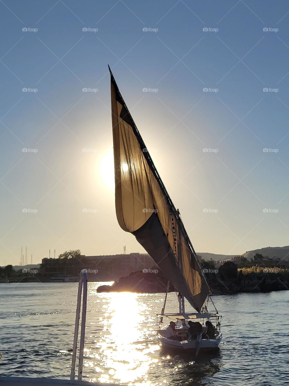 boat ride on a sunny day down the Nile River  at Aswan Egypt