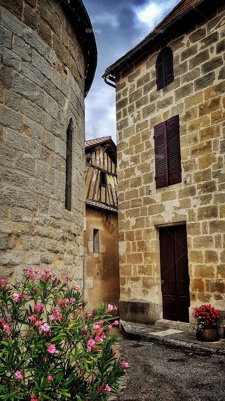 Three French buildings - a church, a house and a workshop