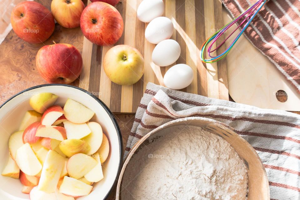 Making homemade puffed apple pie with eggs, sugar and flour.