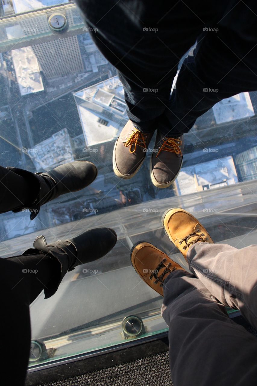 Standing above. On the skydeck at the Sears tower