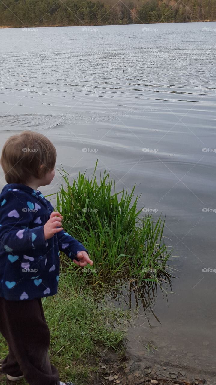 Gabby skipping rocks