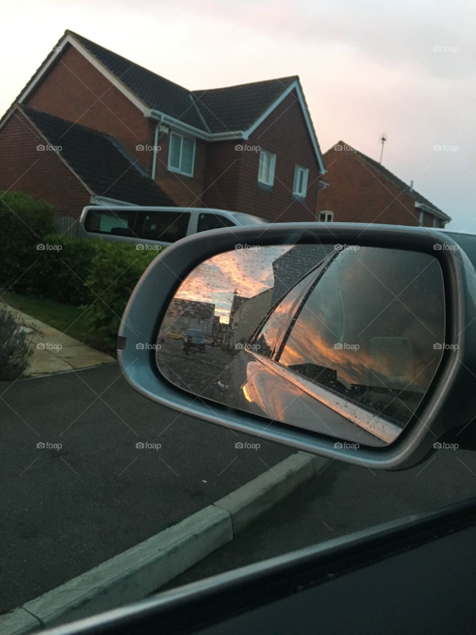 A beautiful reflection of the sunrise in a car wing mirror taken in Kent. Would look stunning in a frame or on a canvas