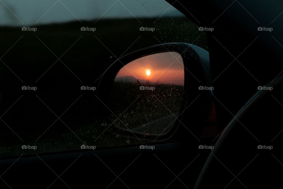 Sunset in a rearview mirror