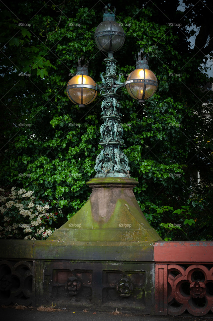 Old victorian street lamp on bridge in London. UK