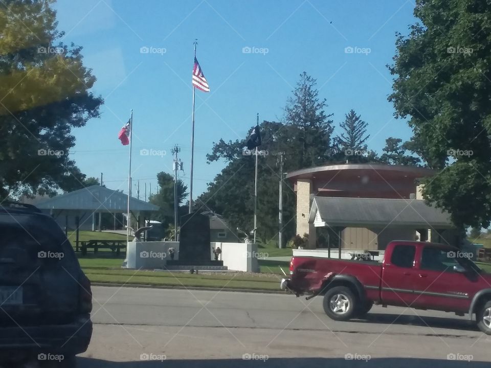 flags red blue truck park