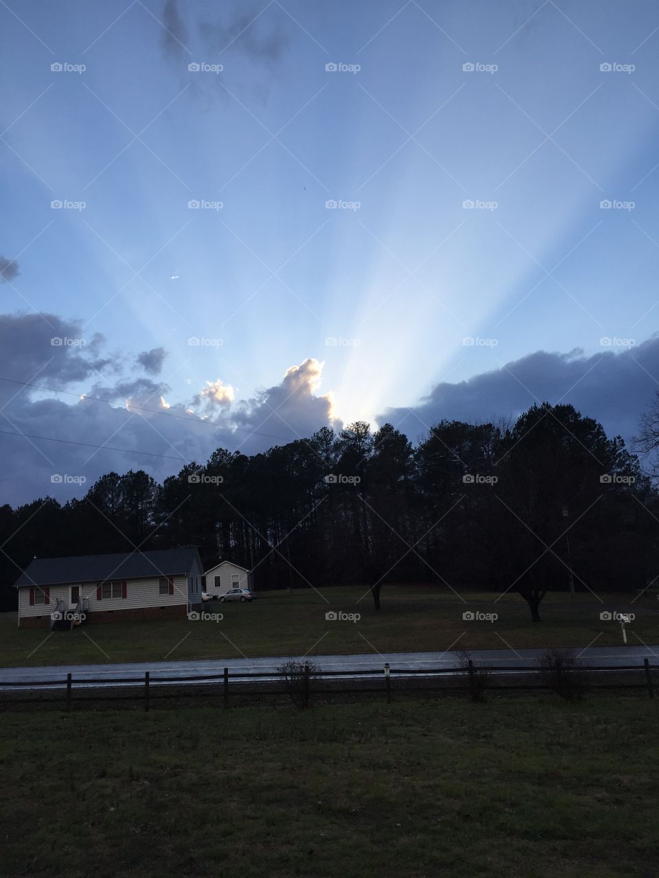 View of sun rays through clouds