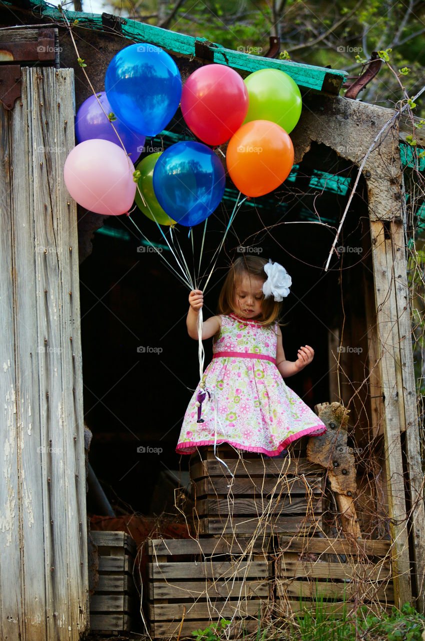 little girl with balloons. my daughter with her balloons