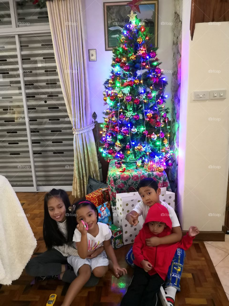 children under the Christmas tree