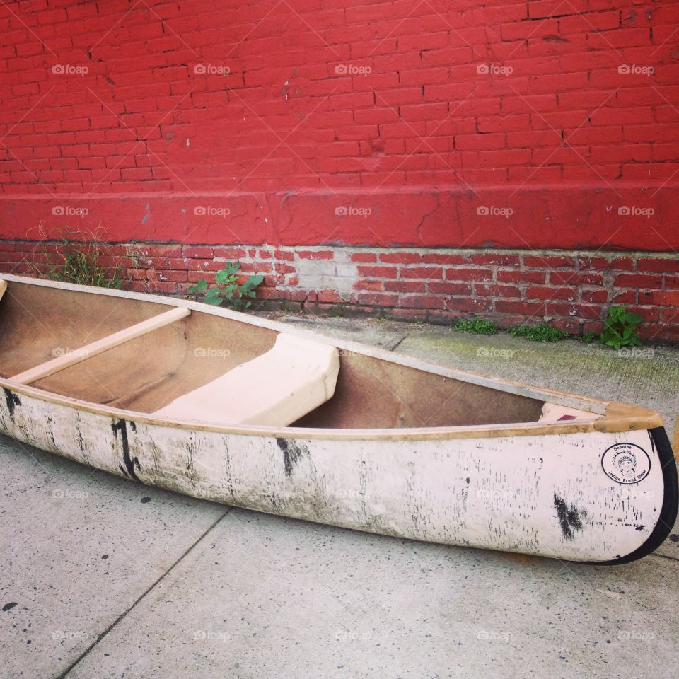 A row boat on the sidewalk in Brooklyn New York 