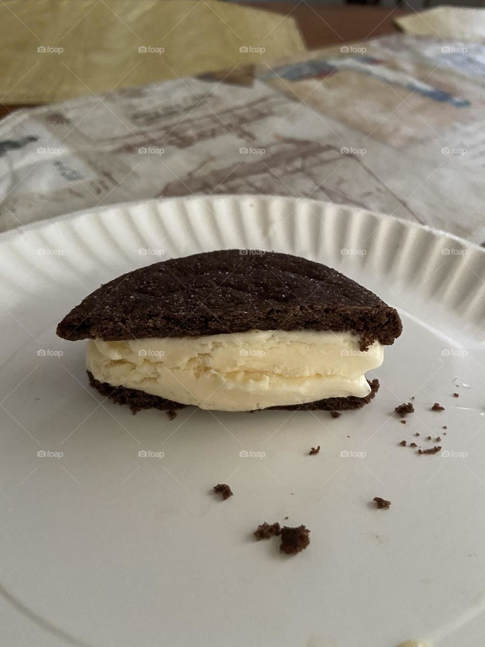 Ice cream sandwich made by putting vanilla ice cream between two halves of a chocolate cookie. I used Stop & Shop Brand Churn style ice cream and an Archway Dutch Chocolate Cookie. Yum ๐