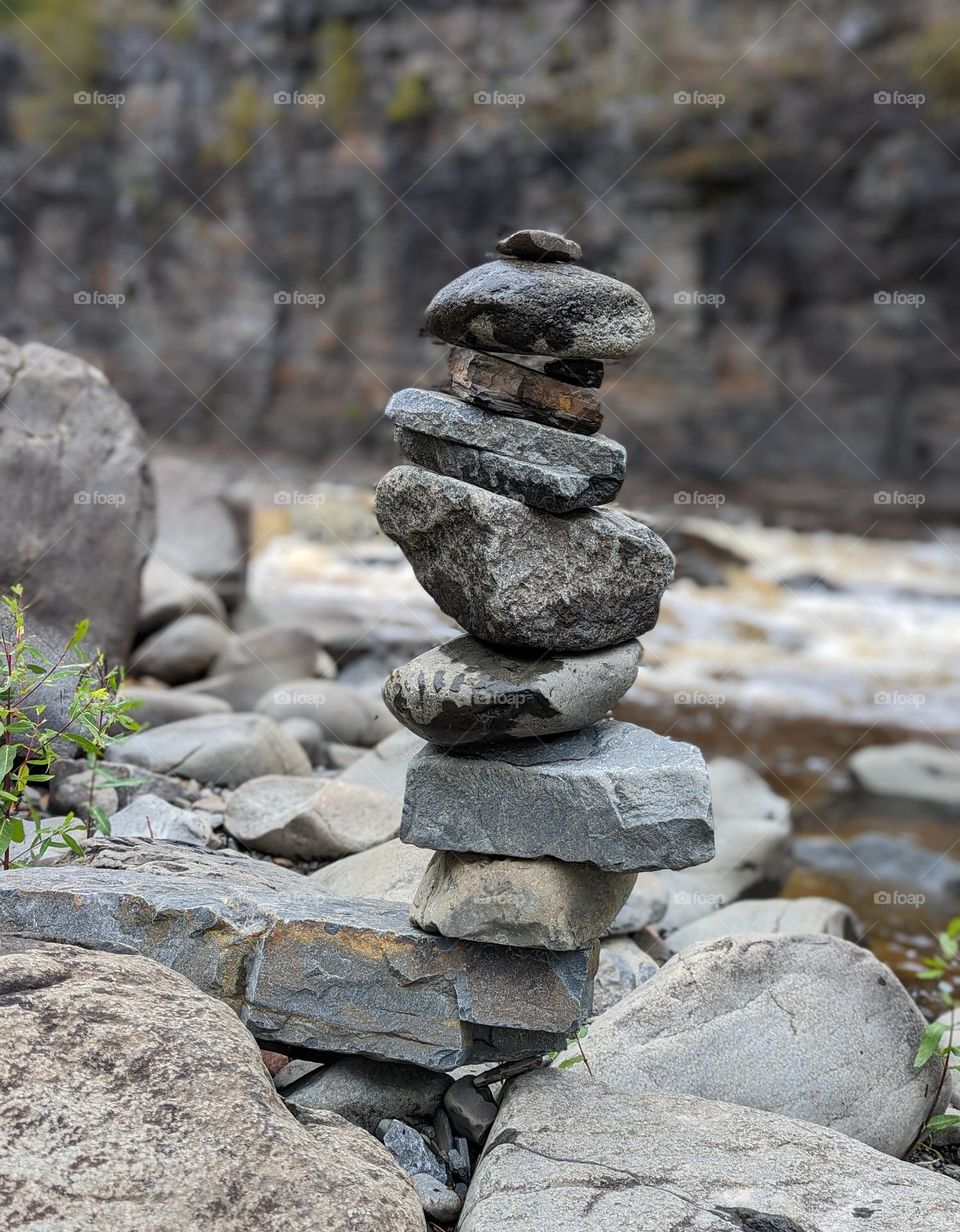 rock cairn building rock stacking along river stacked rocks