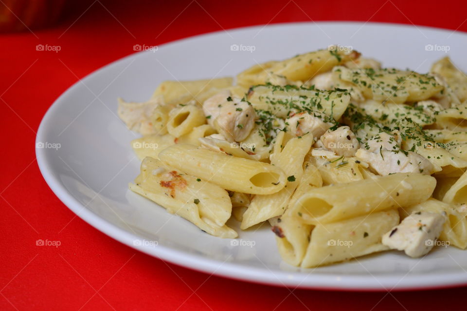 Close-up of pasta against red background