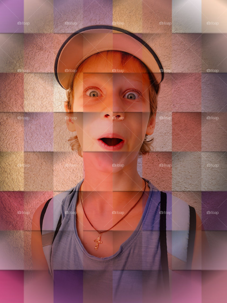 Portrait of a surprised boy in a cap and with a backpack on a background of a wall with interesting multi-colored geometric processing