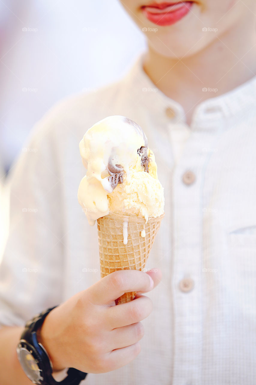 Boy eating fresh  ice cream 