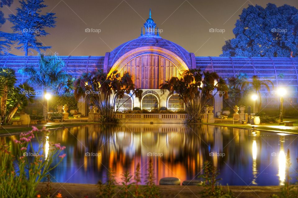 amazing colorful reflection of museum building on a pond at night time. Reflection on water at night time