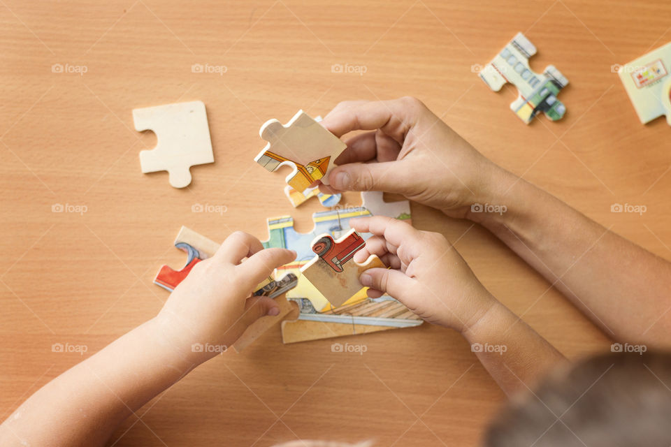 Children putting a puzzle together