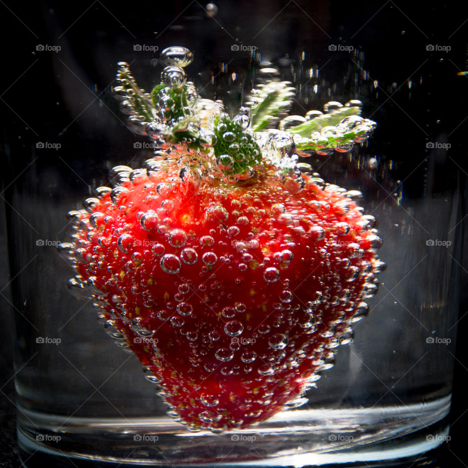 Strawberry bubbles in water