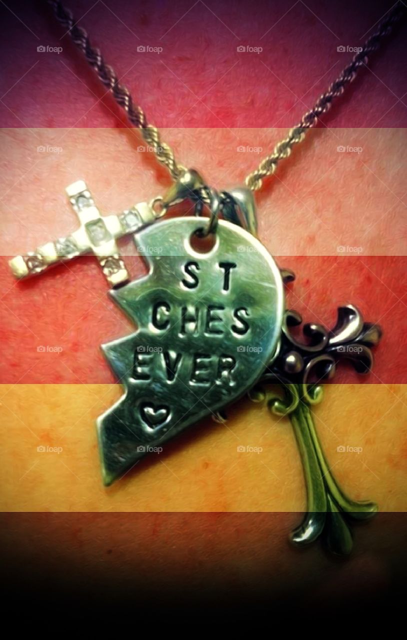 In memory of my best friend. I had given her the half heart which she added to her favorite cross necklace. Love always.